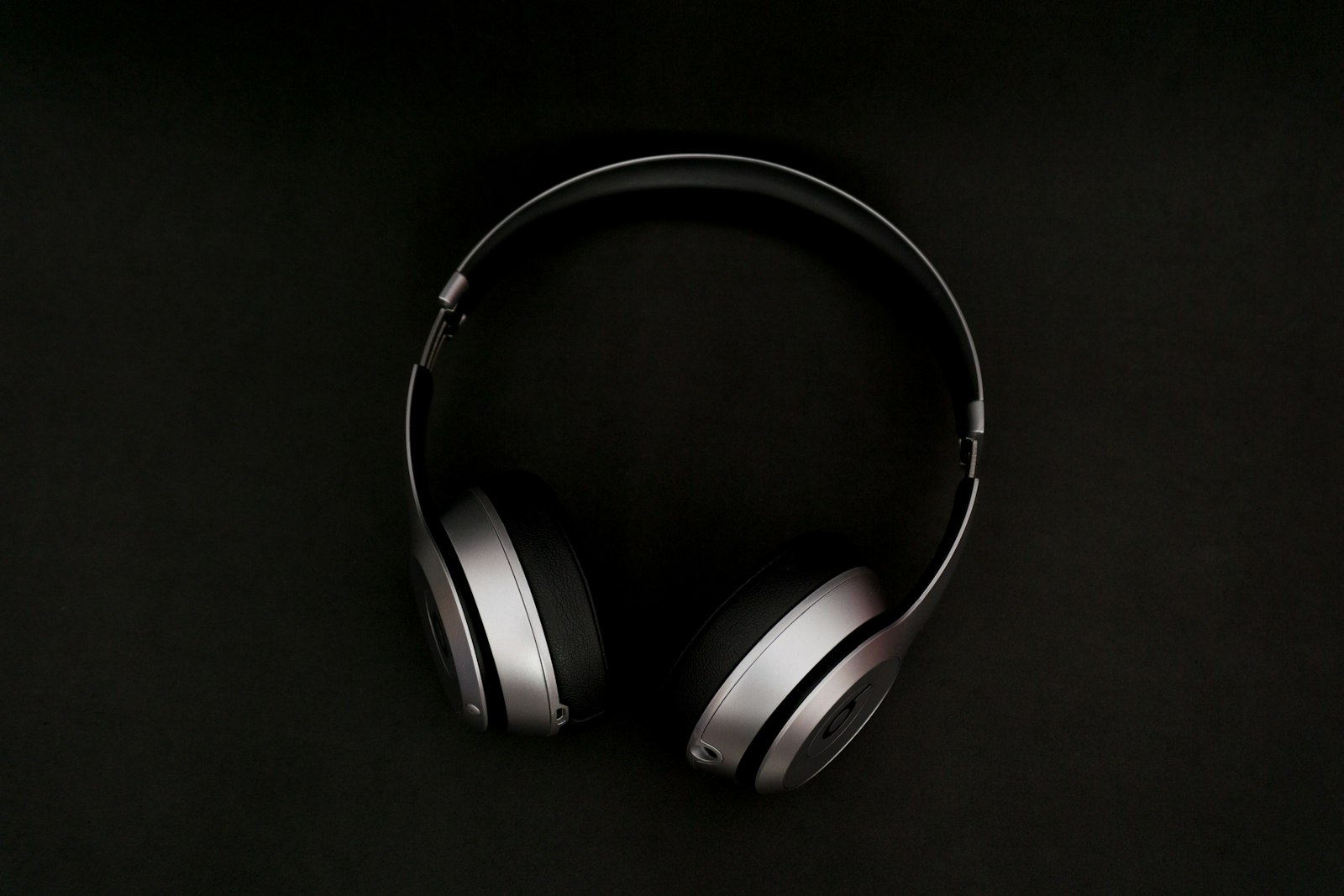 Silver and black over-ear headphones